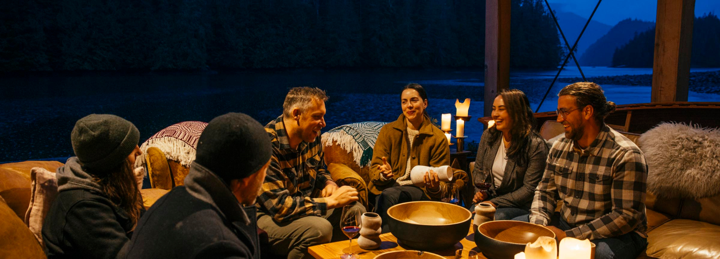 a group of people sitting together discussing pottery and woodworking