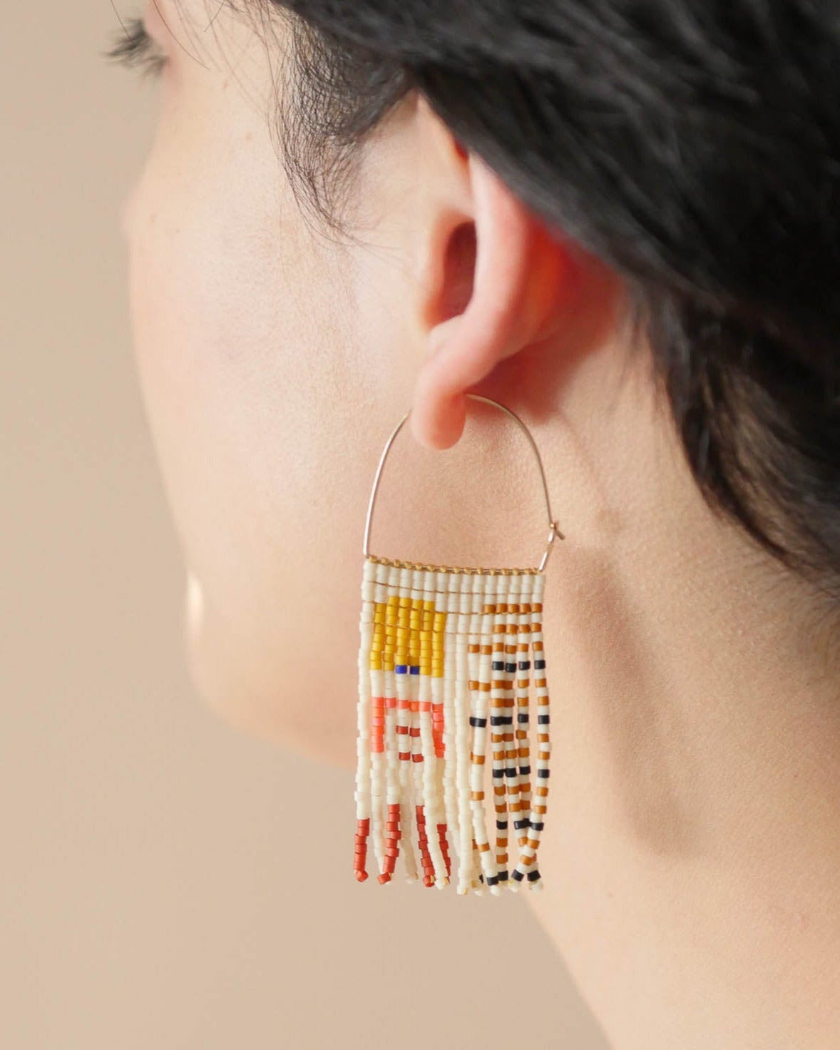 Aiysha Tapesty Earrings in waxwing on model