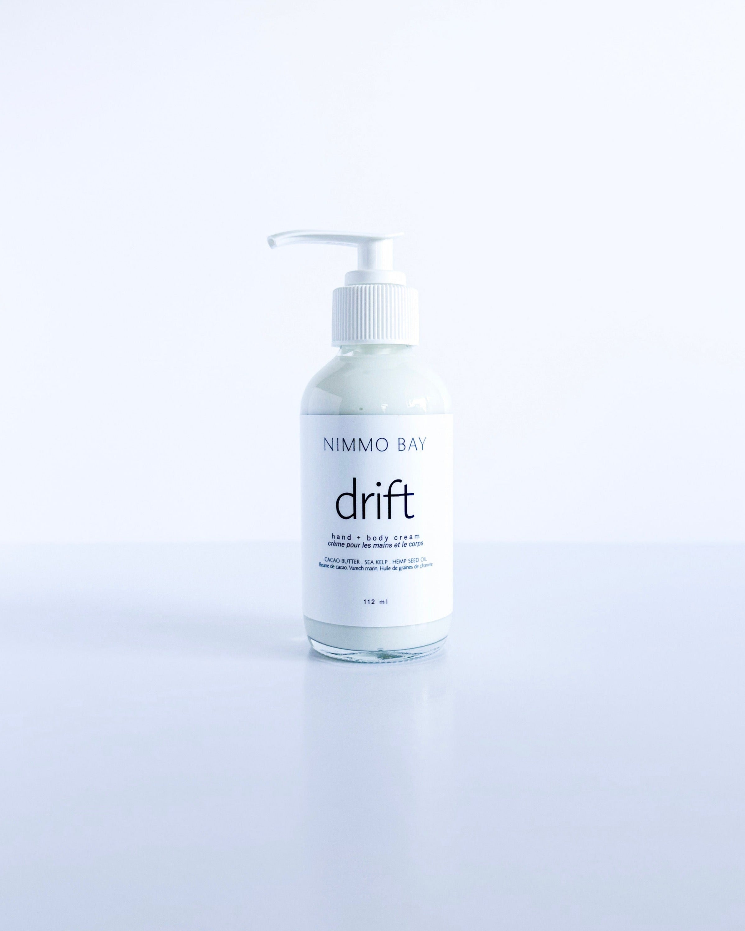 Bottle of Nimmo Bay drift body cream on a white background