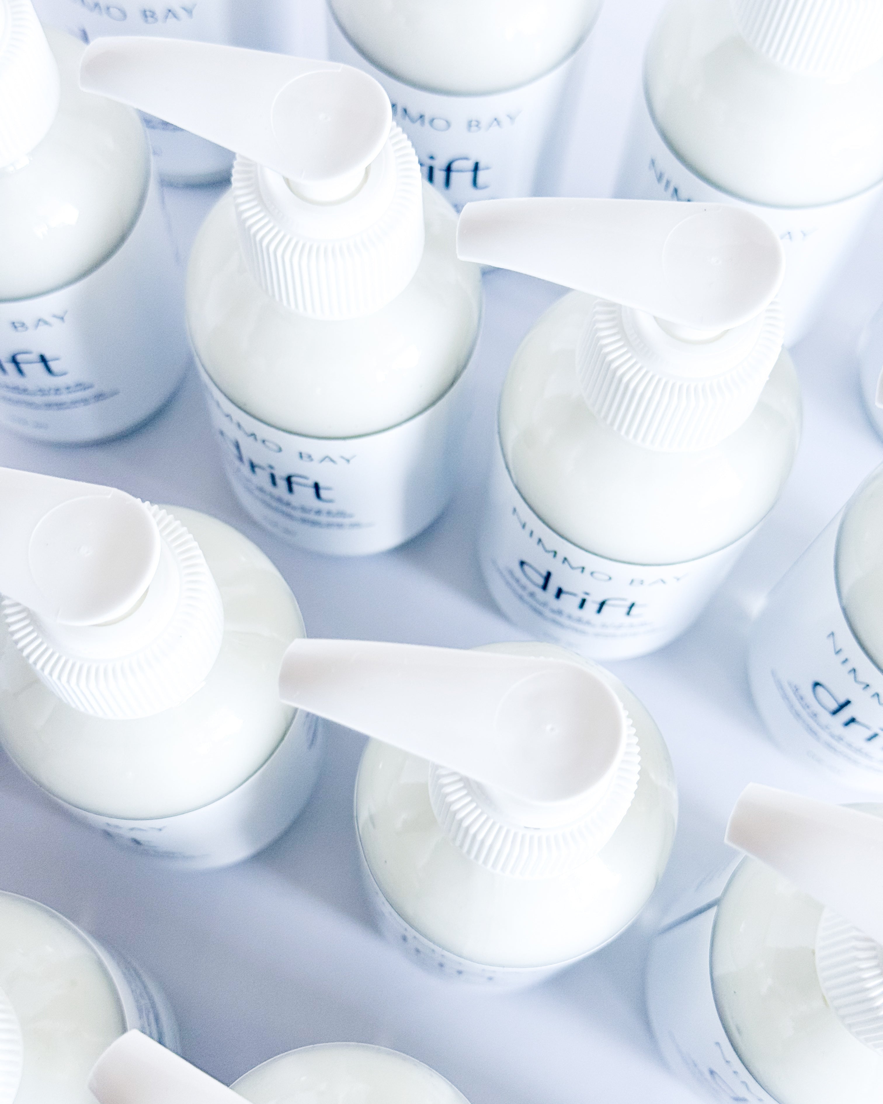 Multiple white containers with 'drift' branding on a light gray background