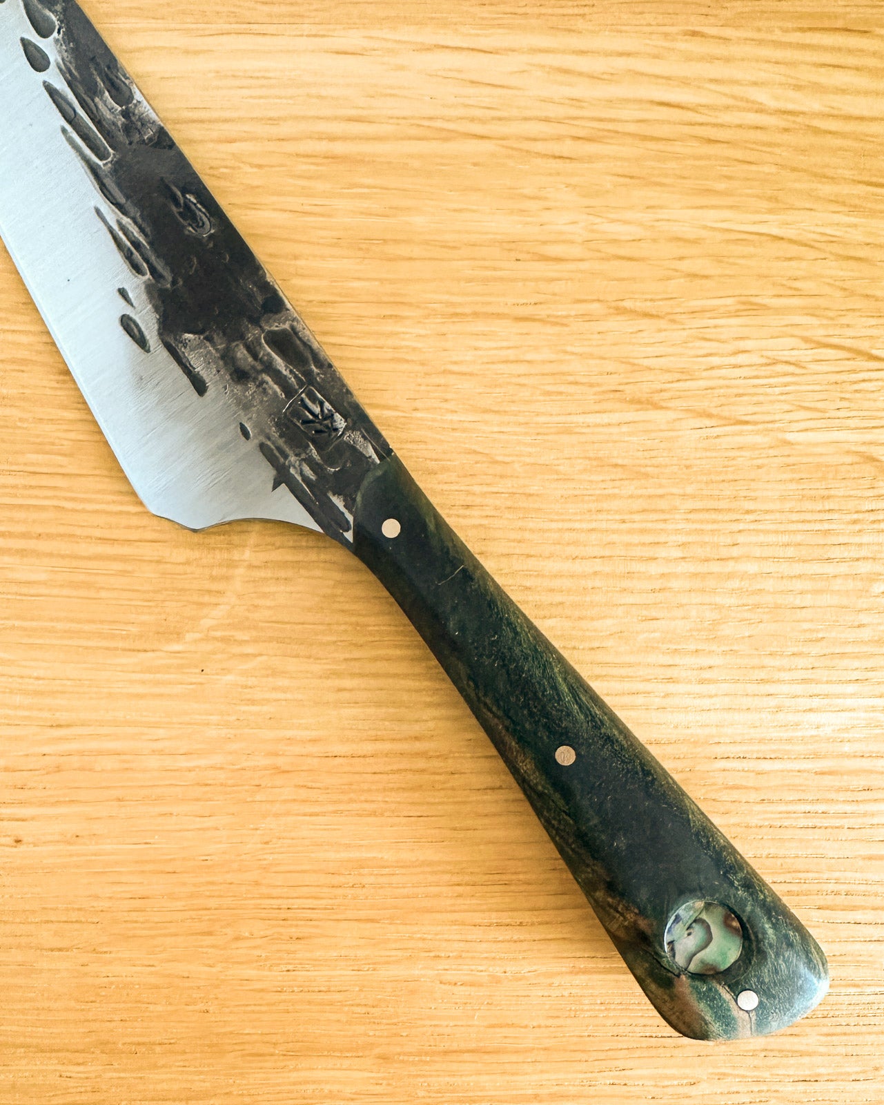 Knife with a textured handle on a wooden surface