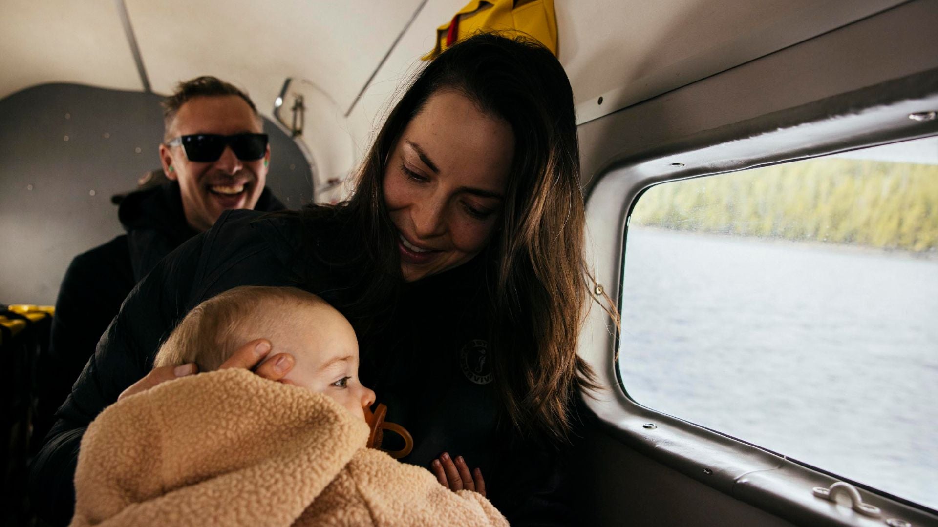 Miller + Co. amily of three inside an airplane