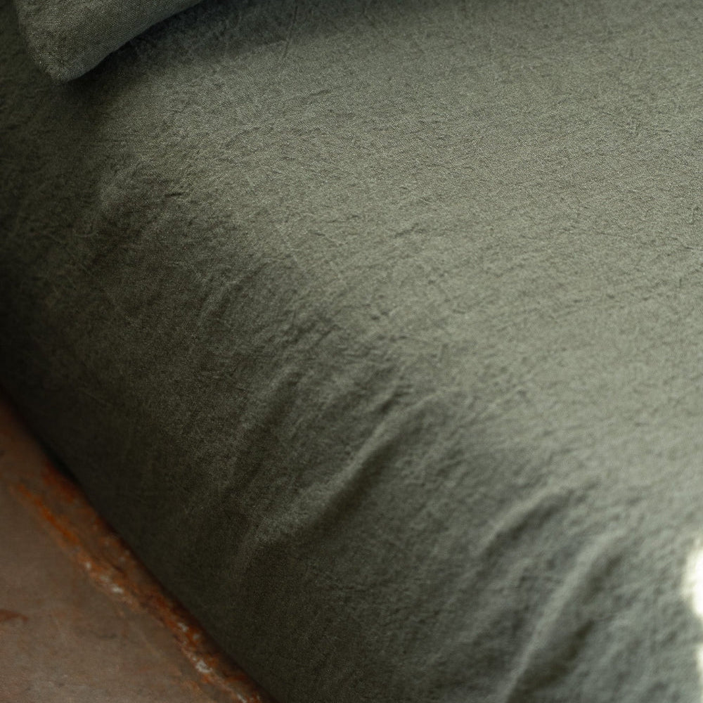 Close-up of a textured green fabric surface