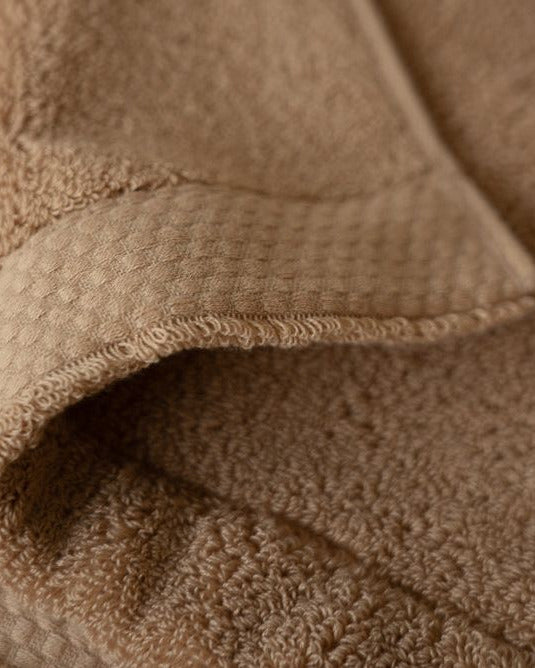 Close-up of a brown textured fabric surface