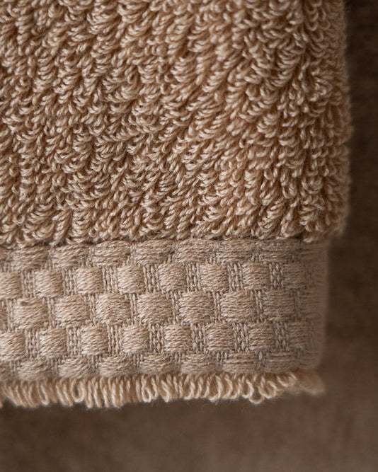 Close-up of a beige towel with textured surface