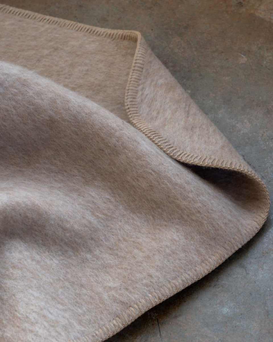 Beige blanket on a textured surface