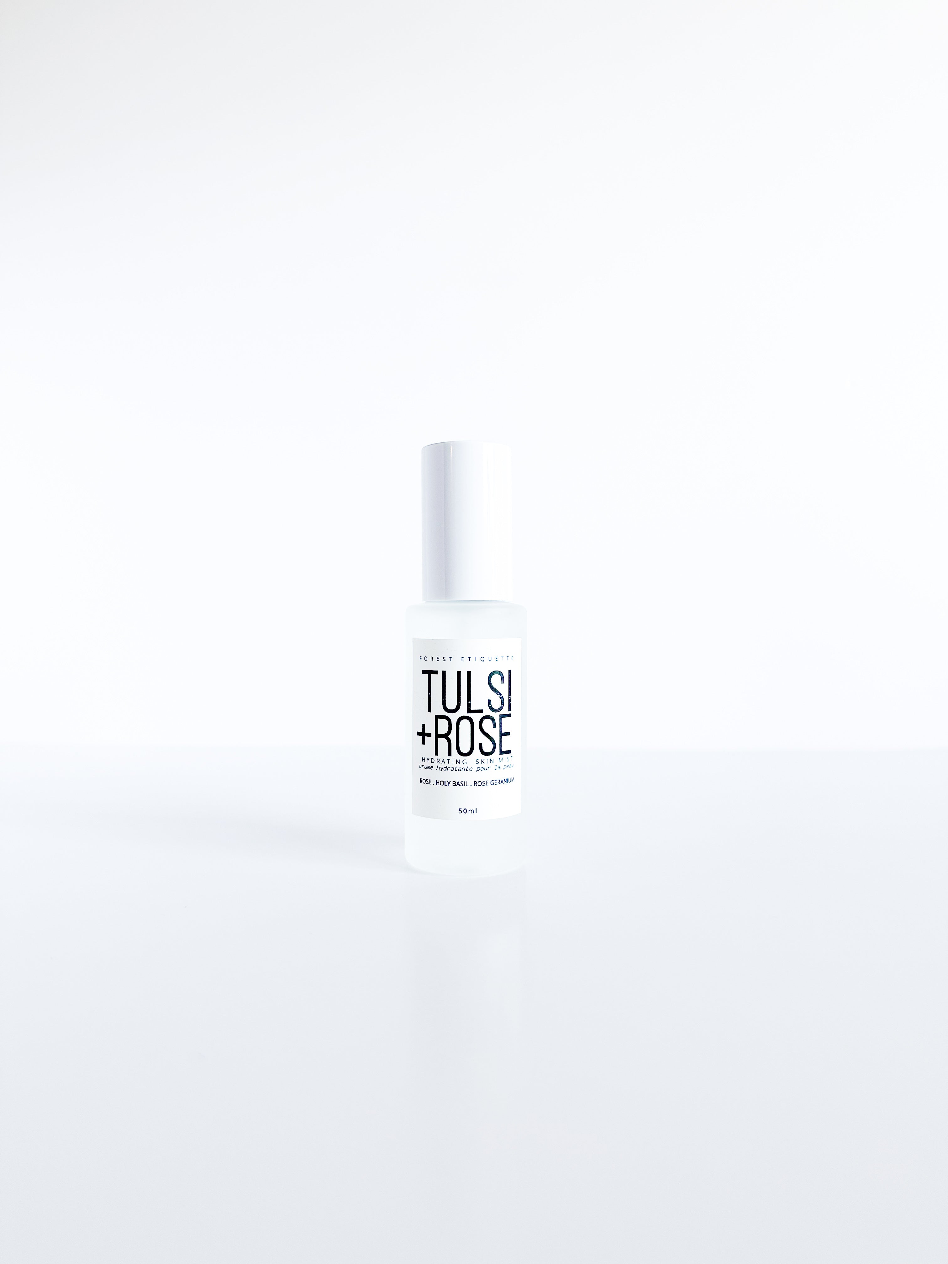 forest-etiquette-tlsirose-facial-mist a clear glass bottle on white background