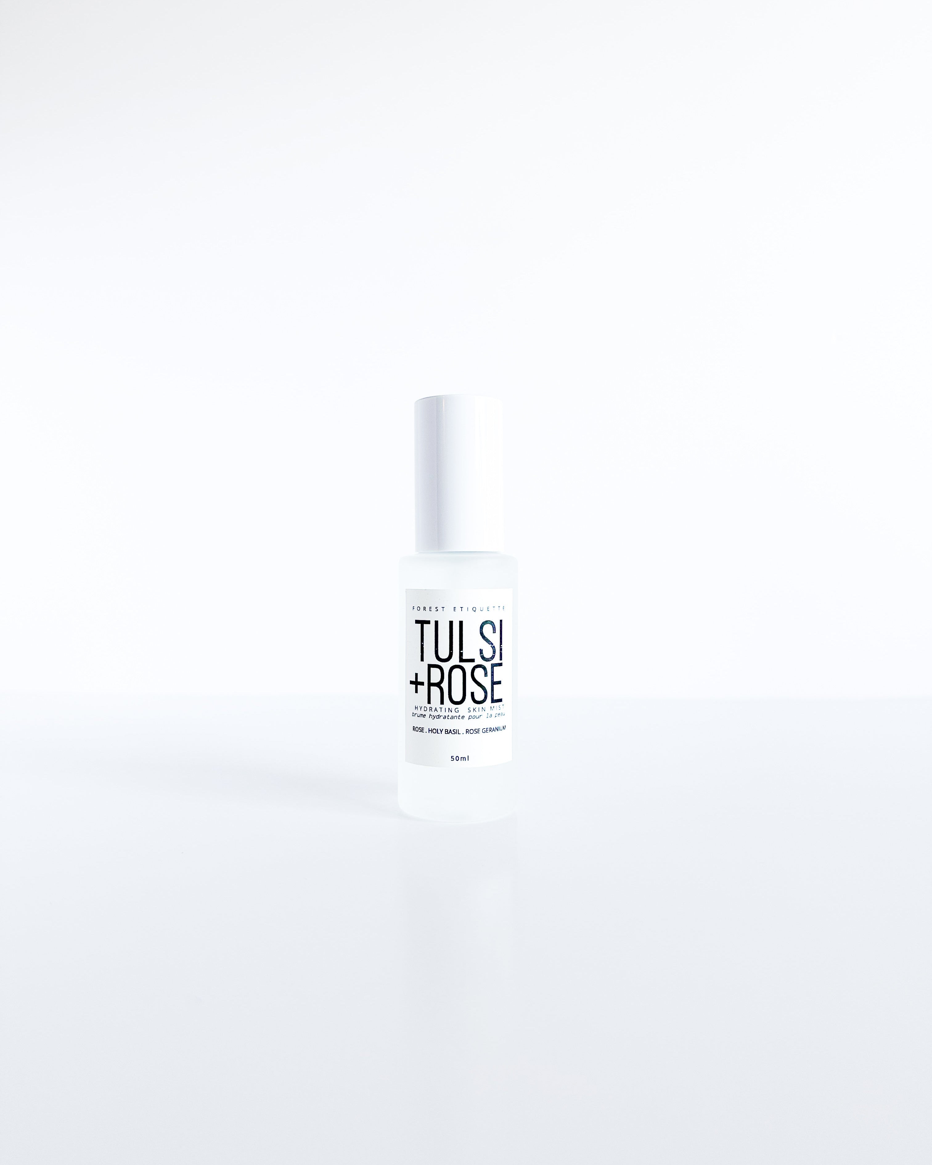 forest-etiquette-tlsirose-facial-mist a clear glass bottle on white background