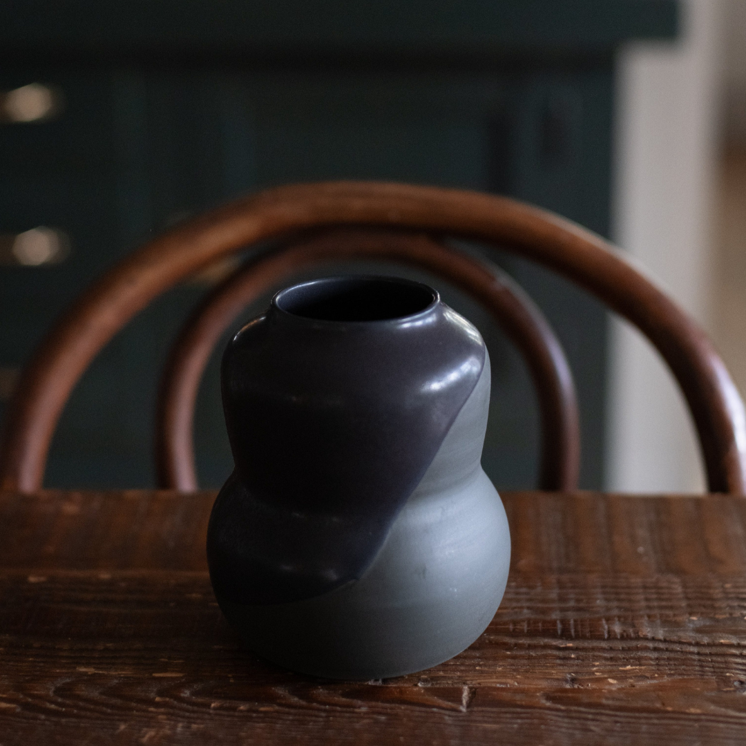 Miller + Co. Black drip vase on tabletop