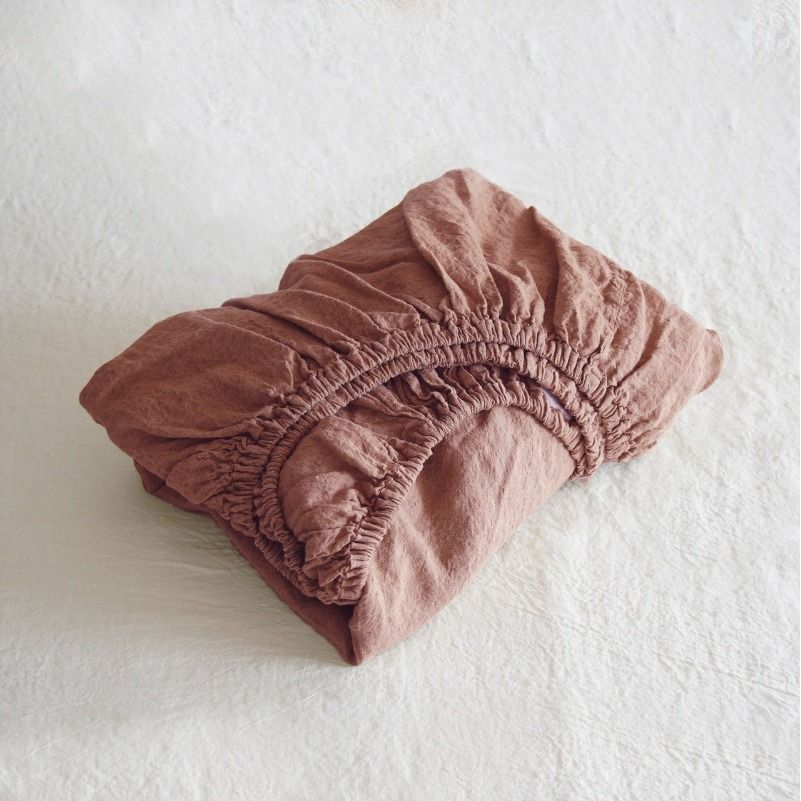 Folded pink fabric on a white background