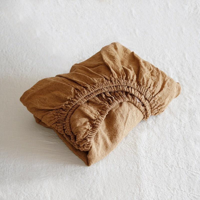 Folded cinnamon folded sheet on a white background
