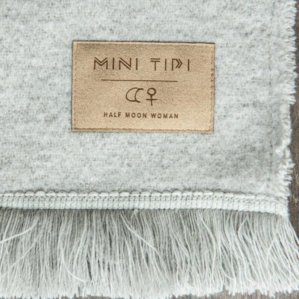 mini tipi eco-friendly everyday blanket in birch bark by half moon woman