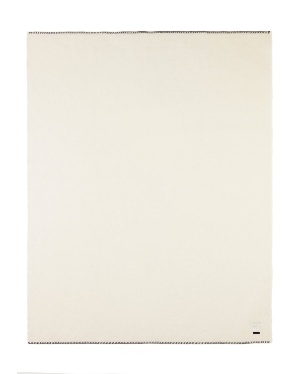 ivory blacksaw blanket with black stitch on a white background