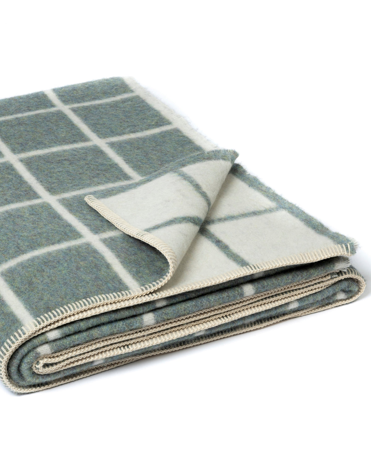 A folded wool blanket with a muted sage green and cream windowpane plaid pattern, shown on a clean white background.
