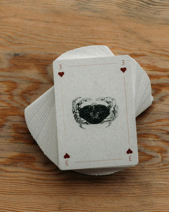 Stack of playing cards on a wooden surface