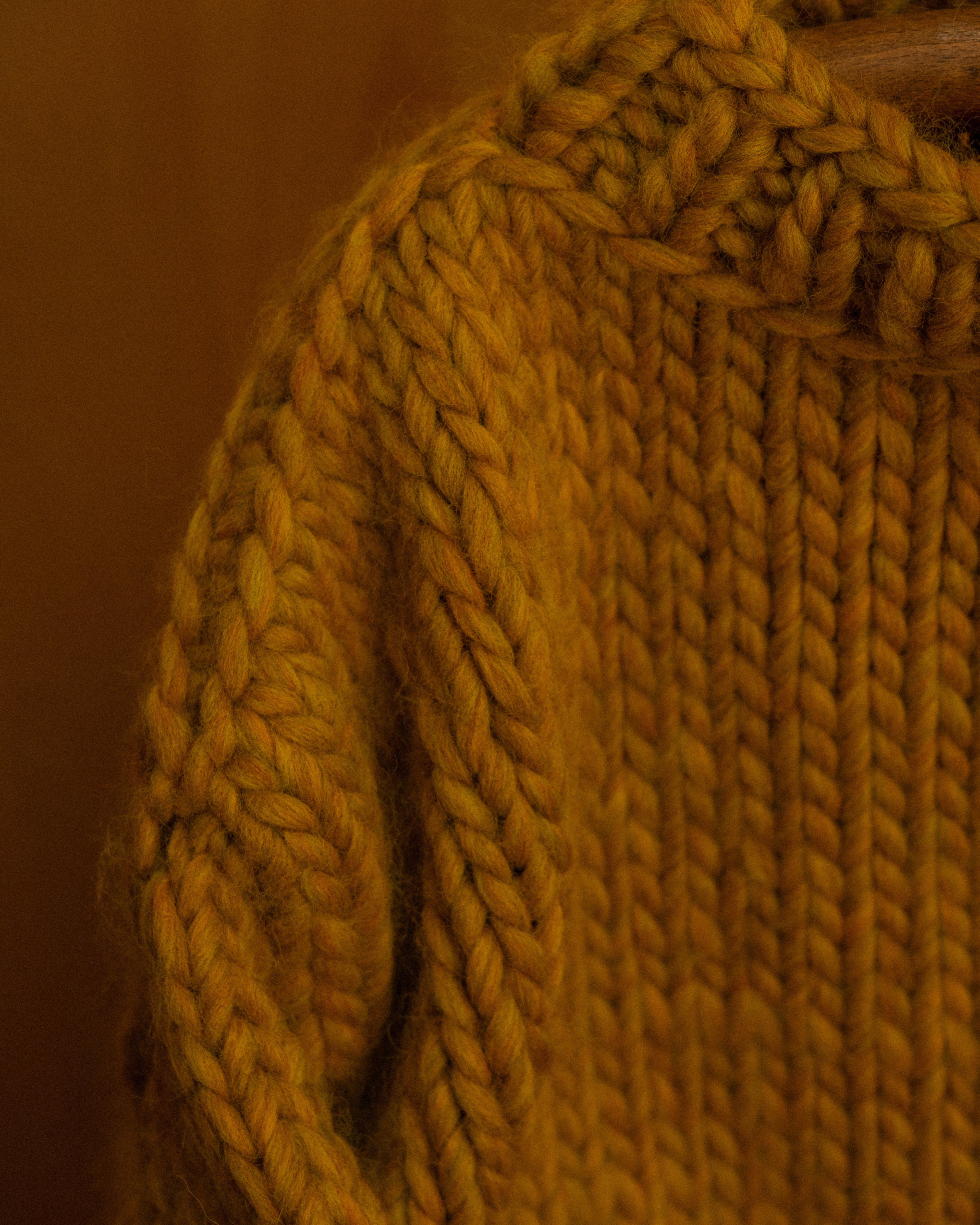 close up of ochre merino wool knit crewneck by Diane Rudge