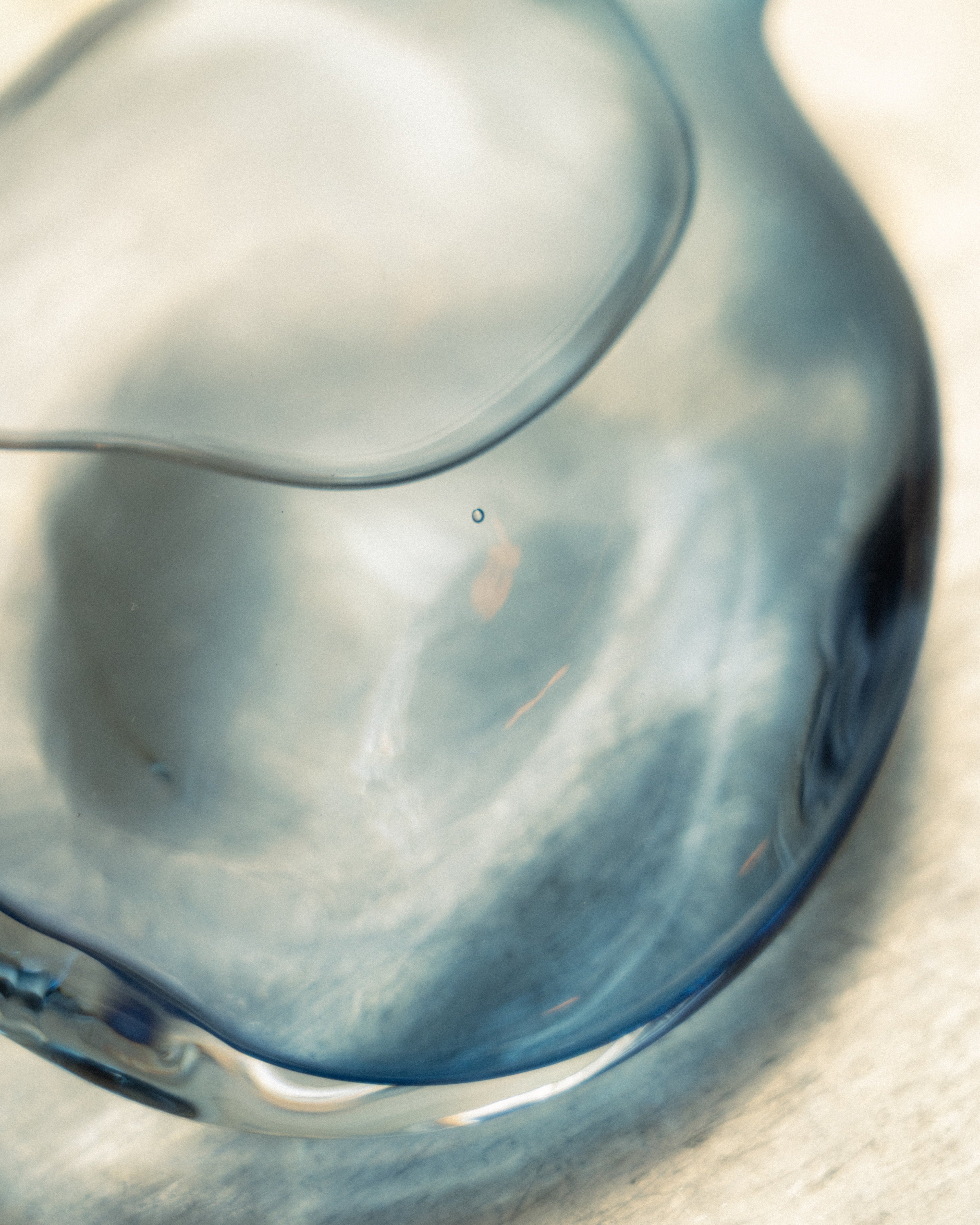 Close-up of a blue flask on a light background