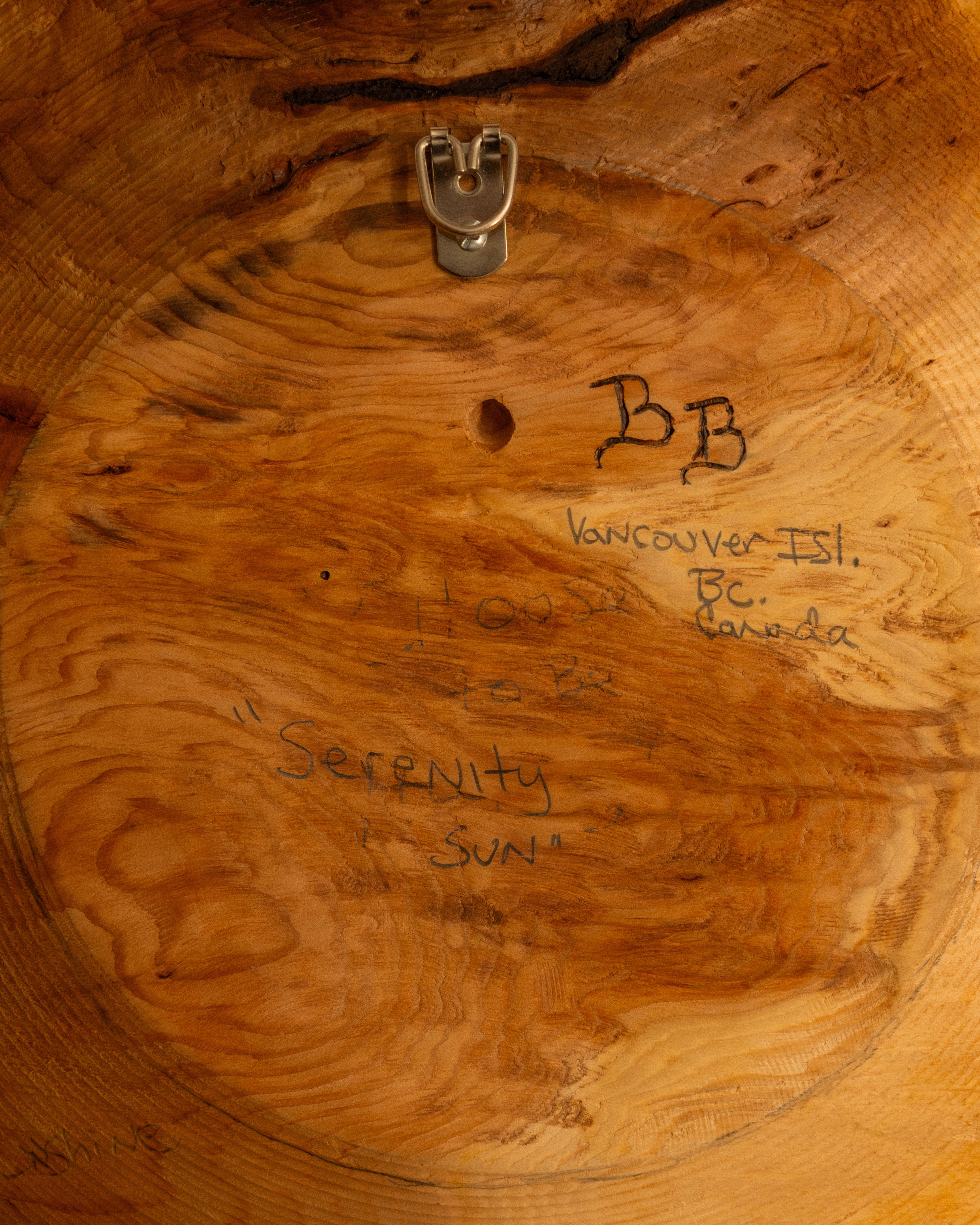 the back of the carving with "BB Vancouver Isl. BC. Canada" Choose to be "Serenity Sun".