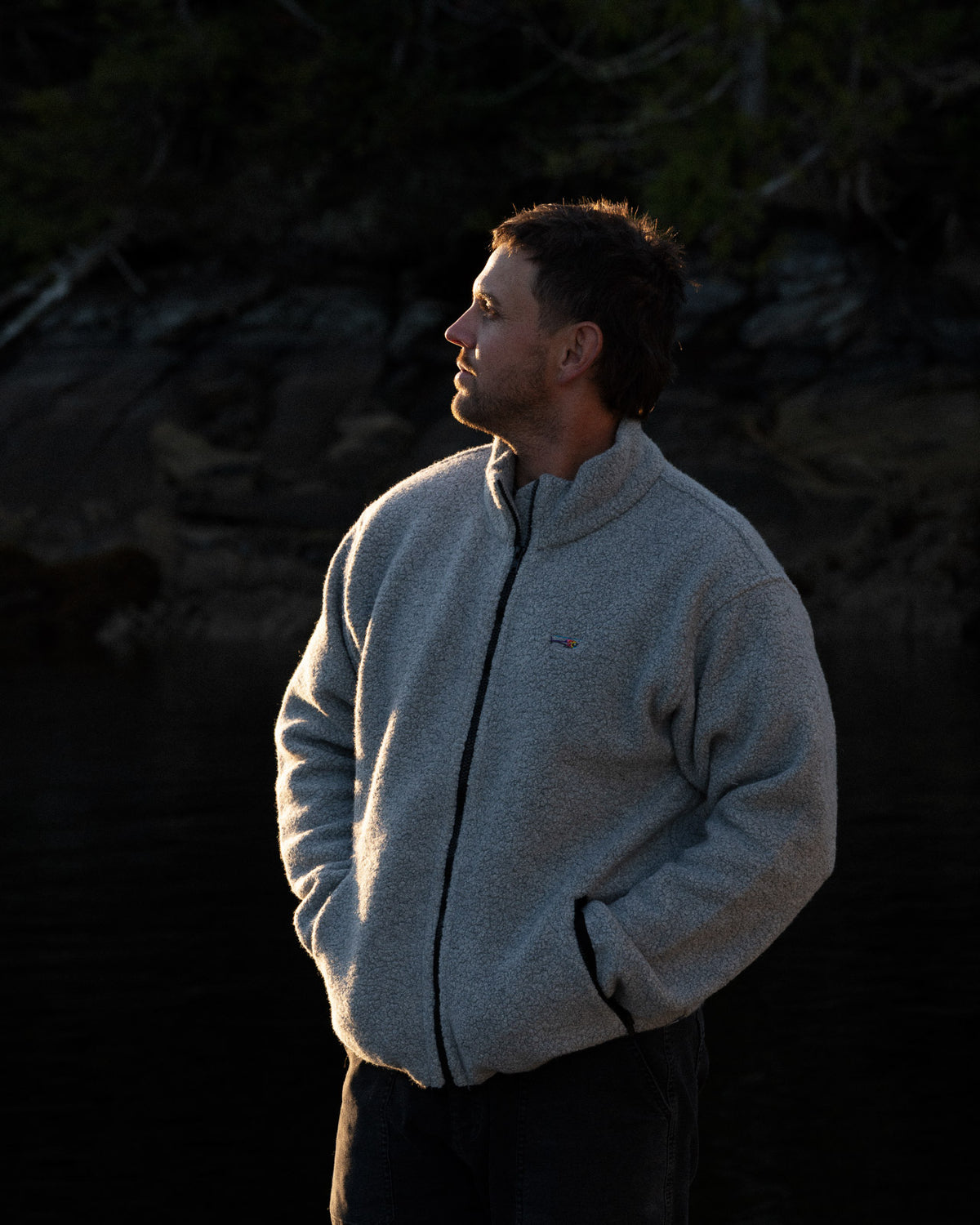 a man wearing a grey fleece jacket