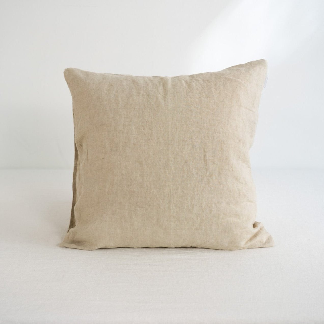 Beige pillow on a white background