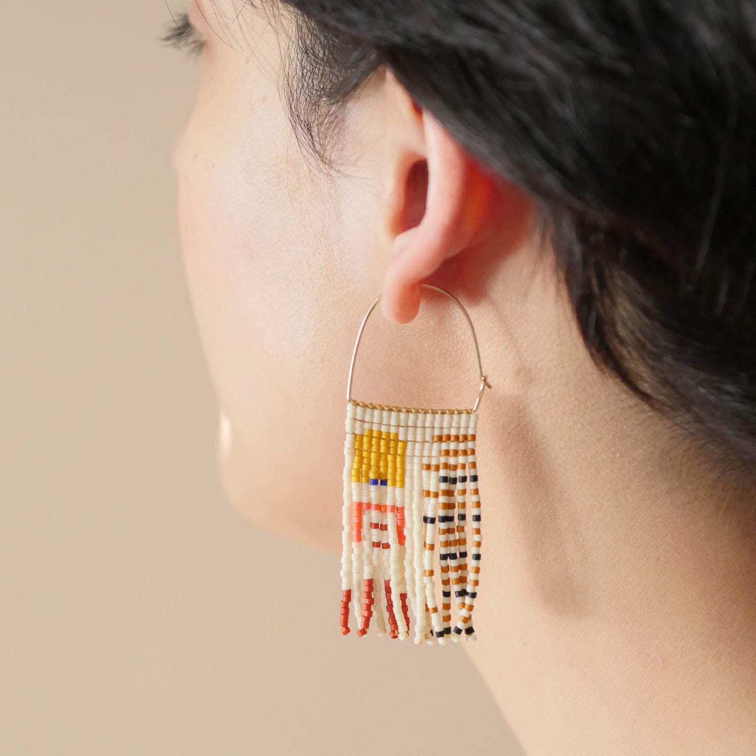Aiysha Tapesty Earrings in waxwing on model