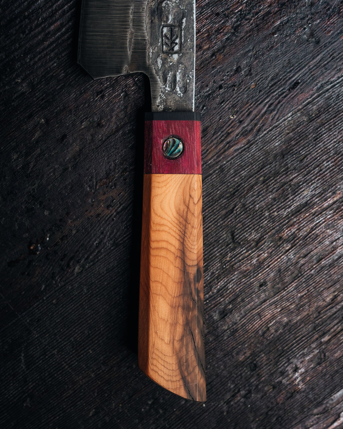Leechtown Blacksmith Co. chef's knife on black background.