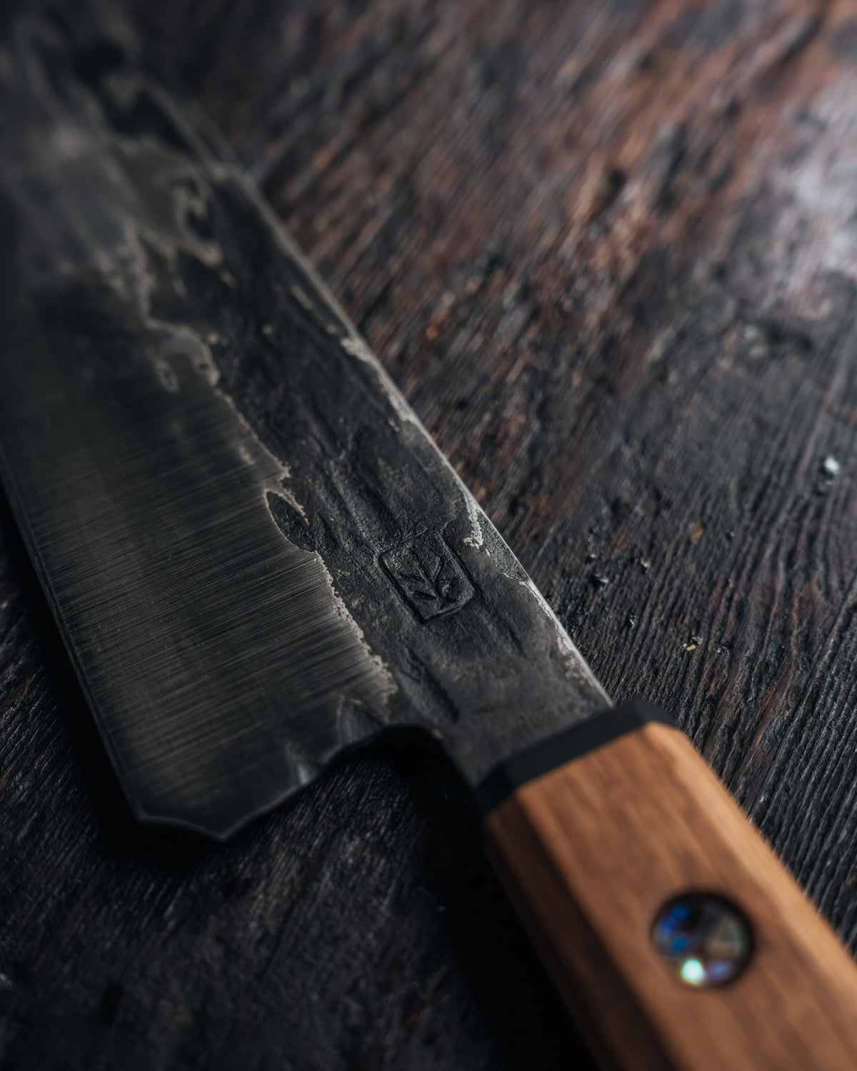 Leechtown Blacksmith Co. chef's knife on black background.