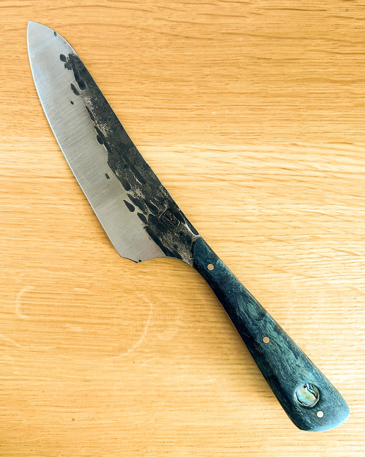 Knife with a wooden handle on a wooden surface