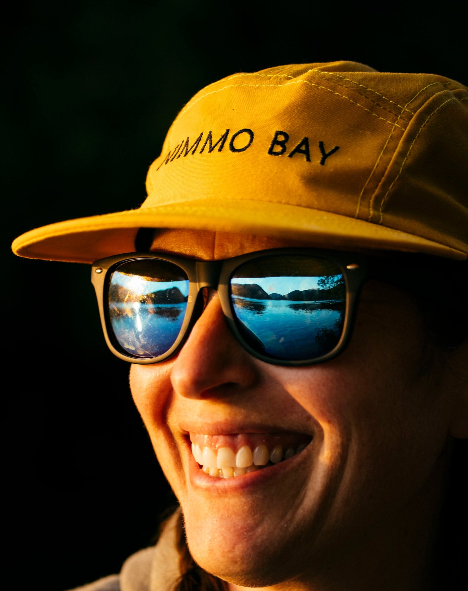 Yellow tin hat on woman at Nimmo Bay
