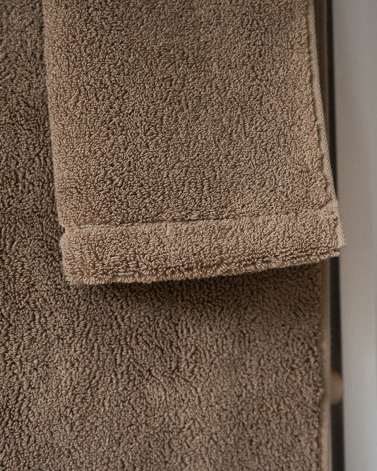 Close-up of a brown towel with a blurred background