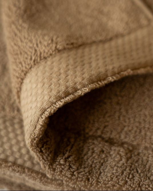 Close-up of a brown textured fabric surface