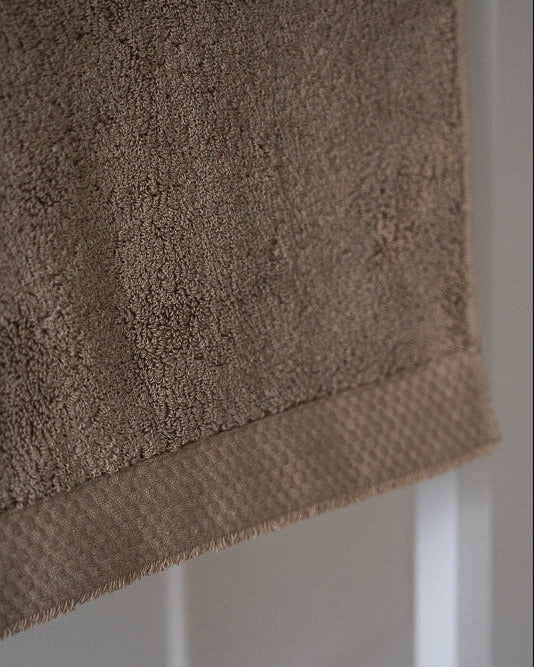 Close-up of a brown towel with a blurred background