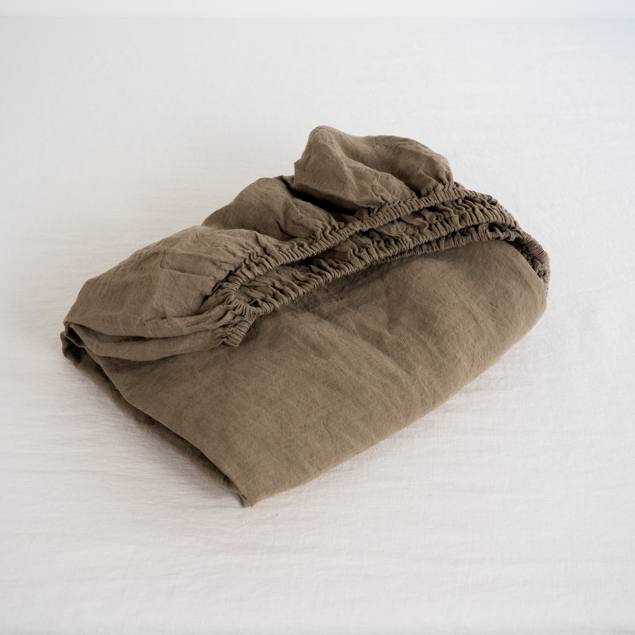Folded brown fabric on a white background