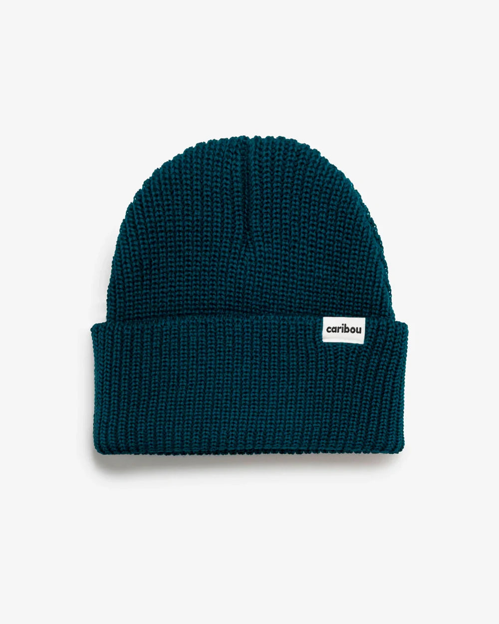 Blue knit beanie with a brand label on a white background
