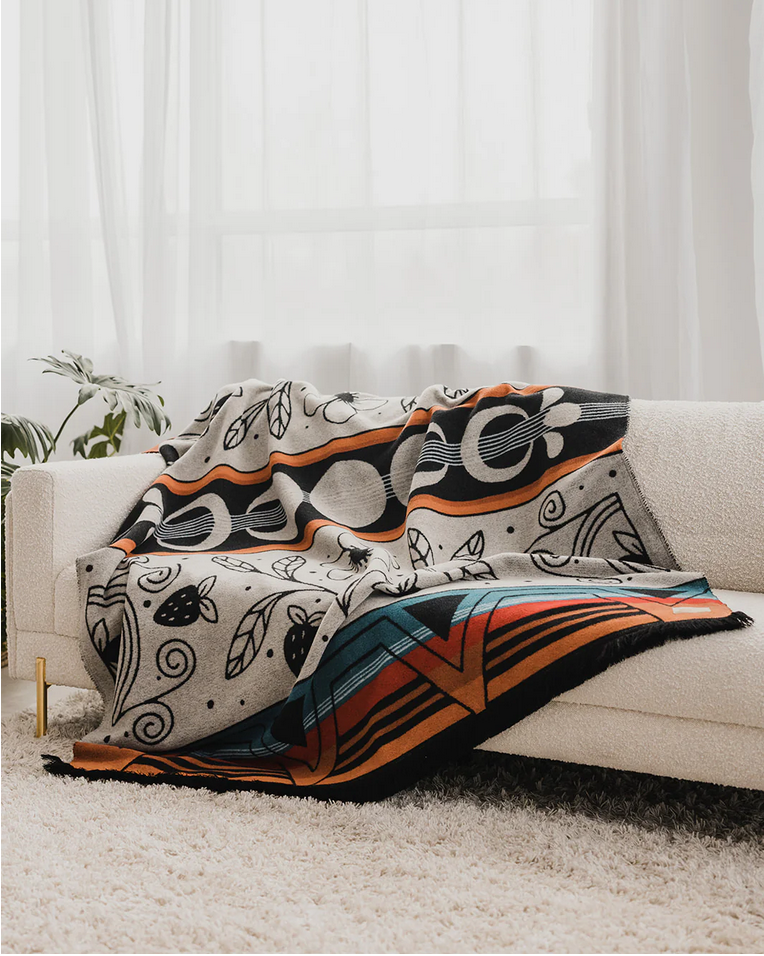 Mini Tipi Ceremony reversible blanket styled on sofa