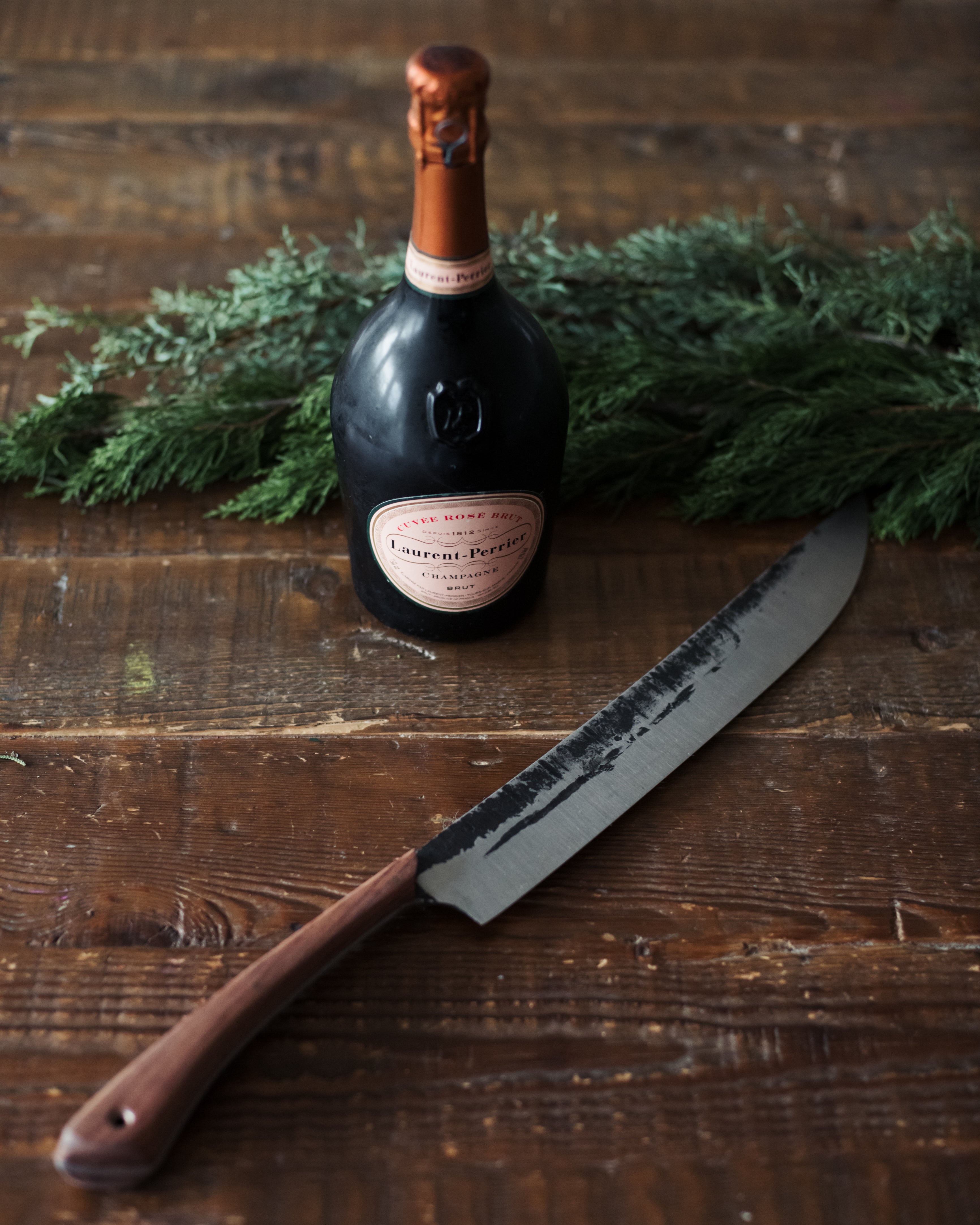 Leechtown Blacksmith Co. custom champagne sabre with hand-forged steel blade and wooden handle