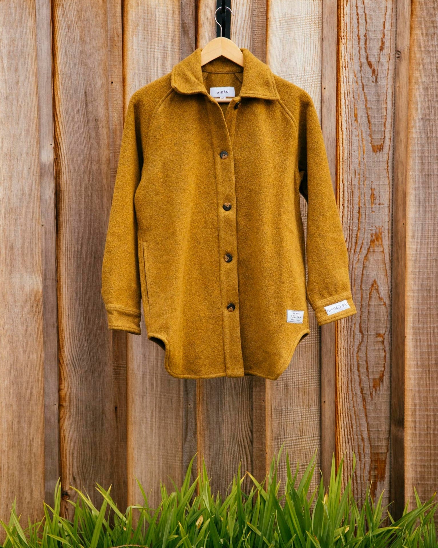 Anian gold loft coat, hanging.