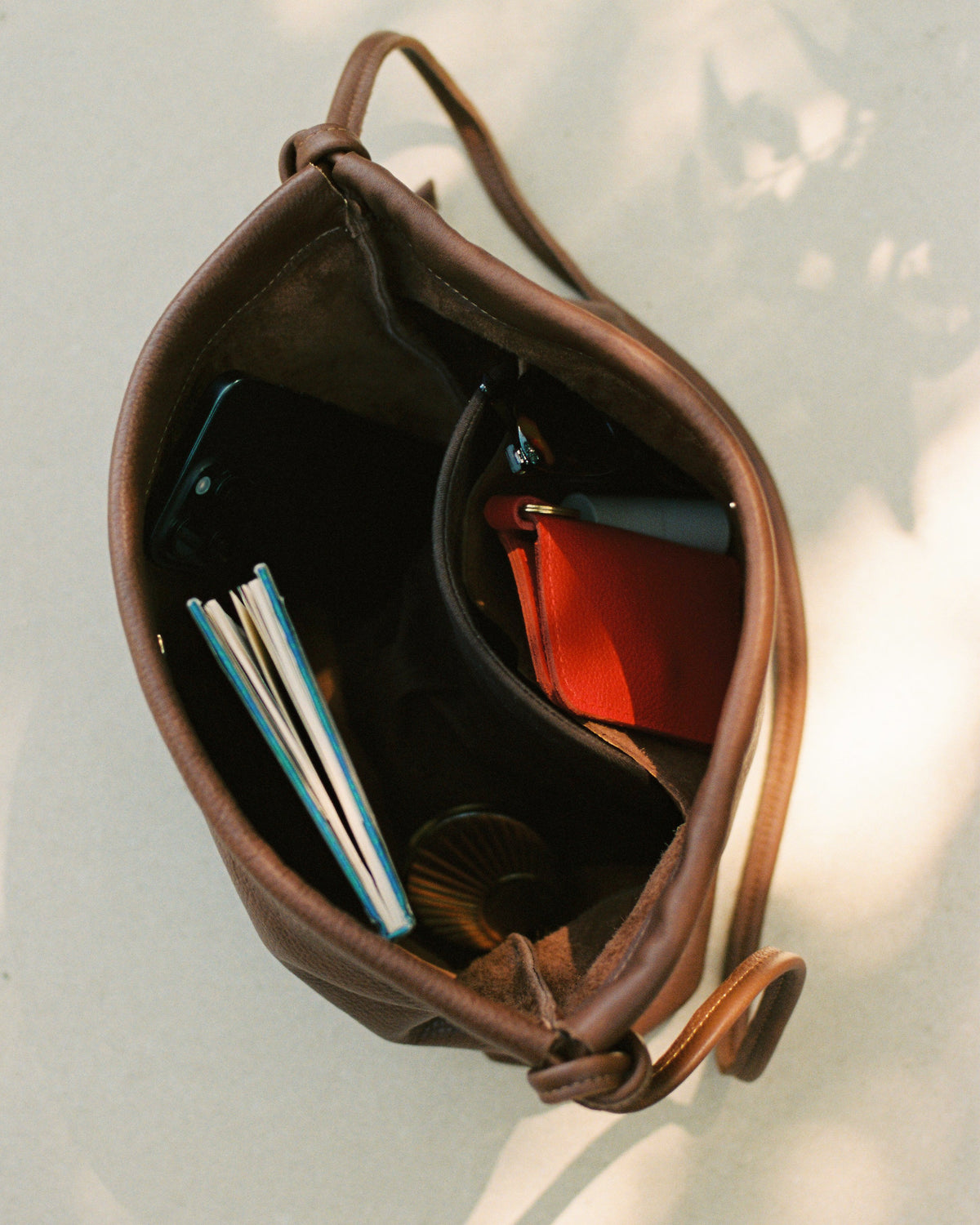 the inside view of a brown leather handbag