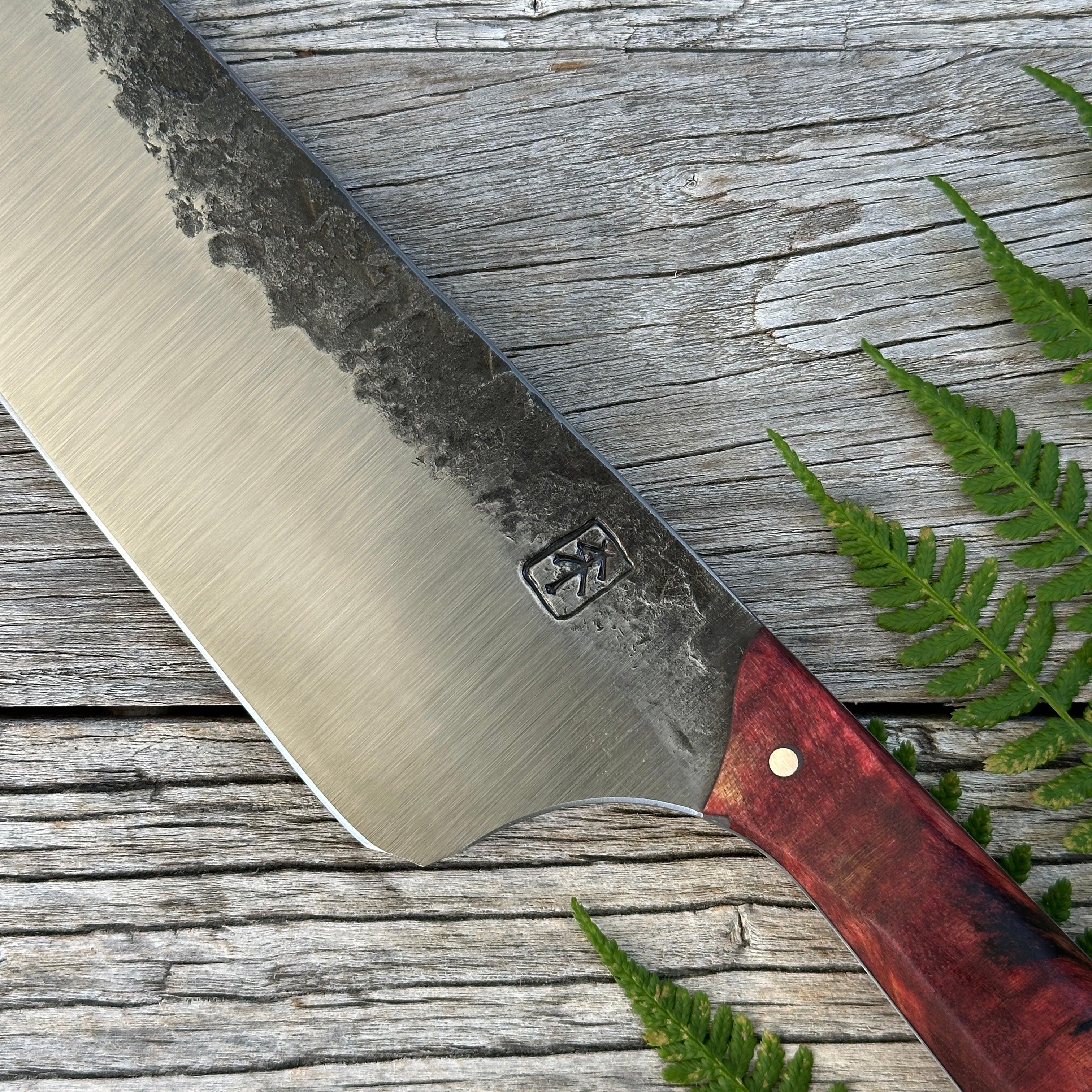 Leechtown Blacksmith Co. for Confluence Nimmo Bay knife with a natural handle on a wooden surface 