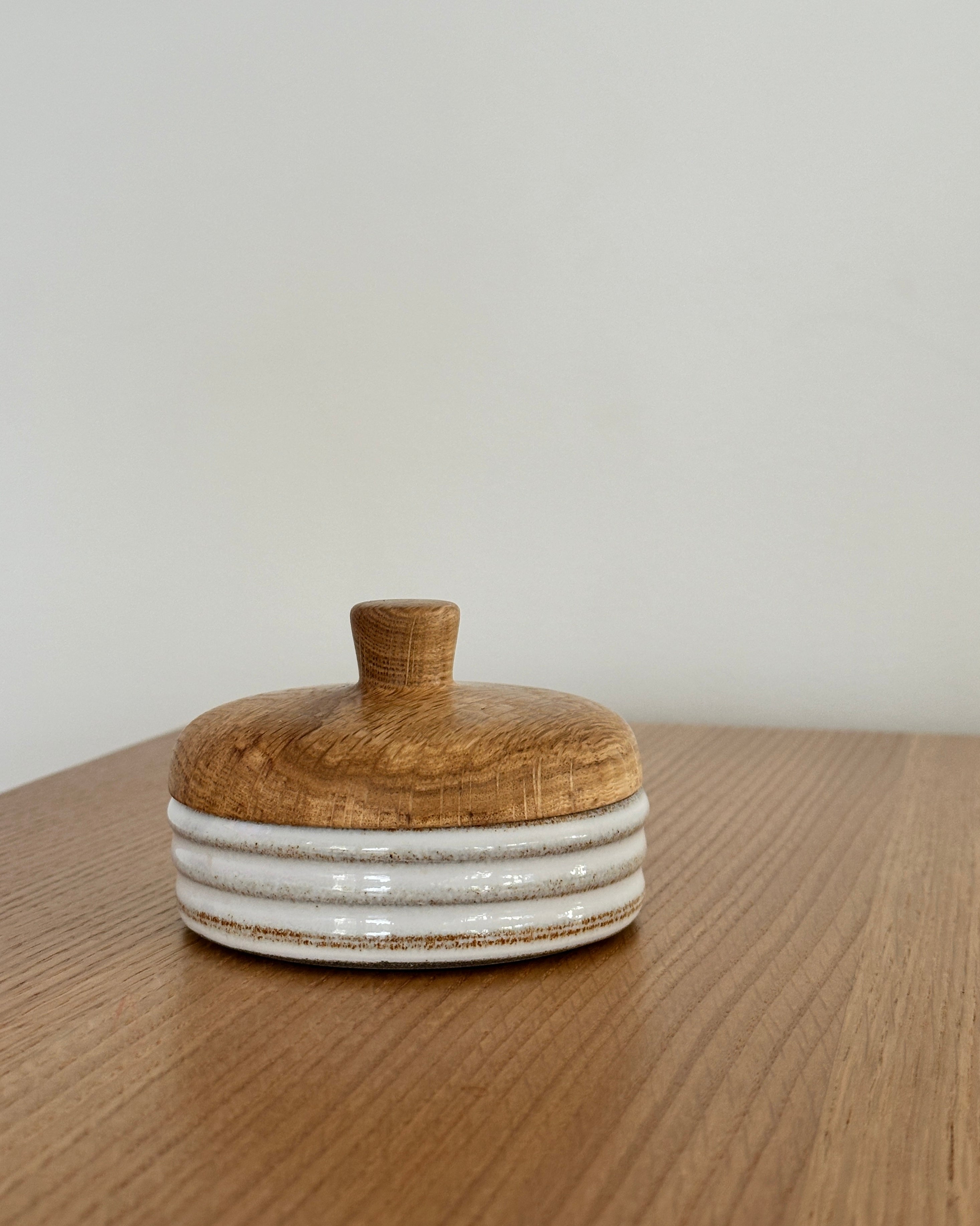 small oak lid and clay vessel by Miller and Co for Confluence Nimmo Bay