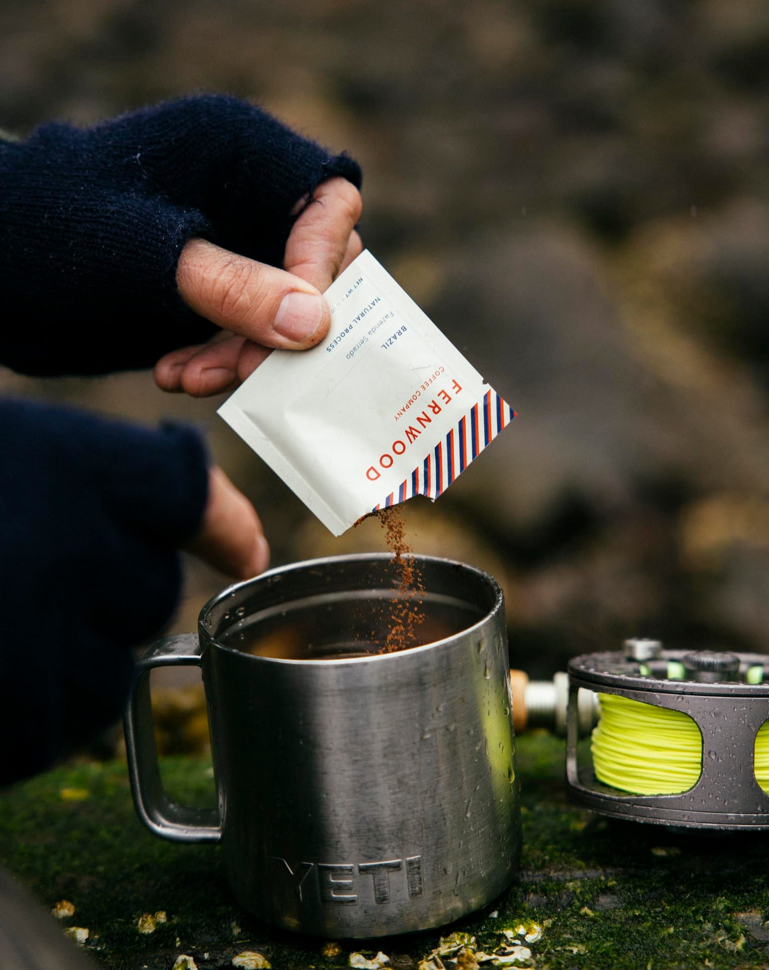 Fernwood coffee instant pack being poured into a Yeti travel mug