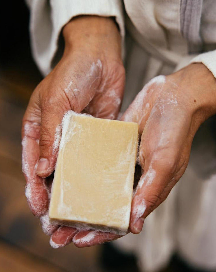 hands washing with honey and lavender ALTR soap bar 
